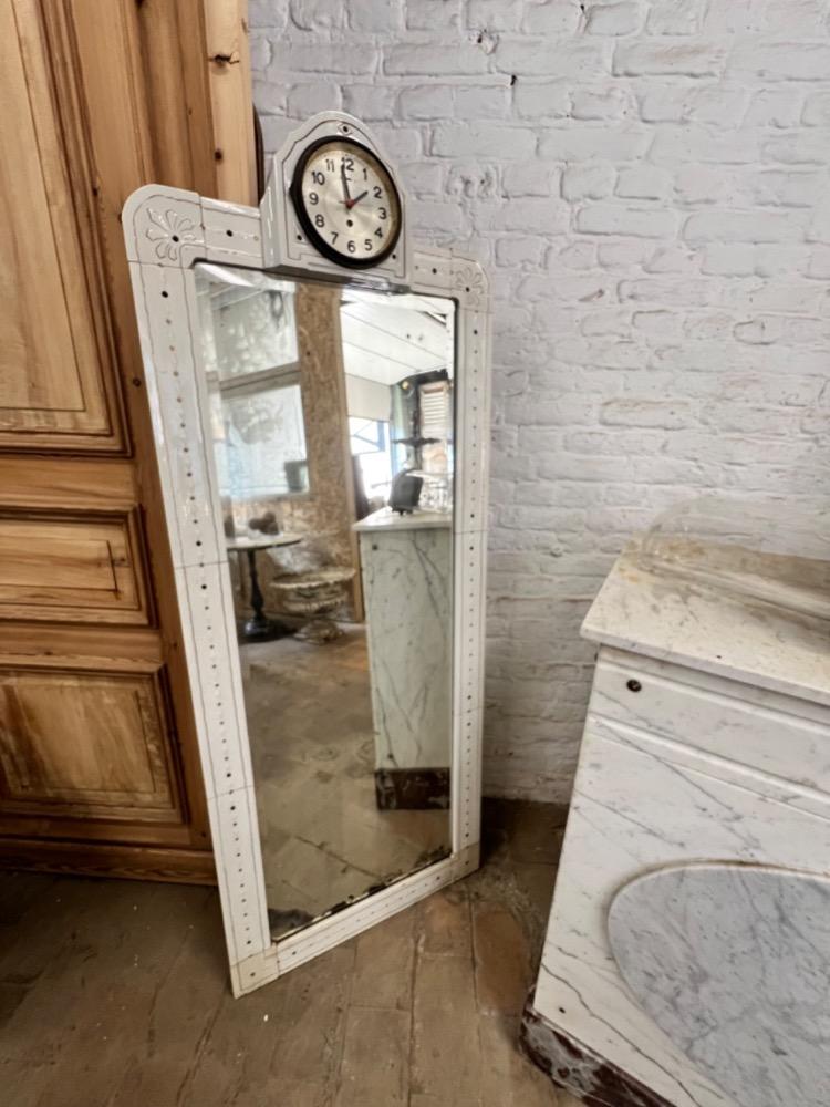 Earthenware mirror with clock, early 20th century 