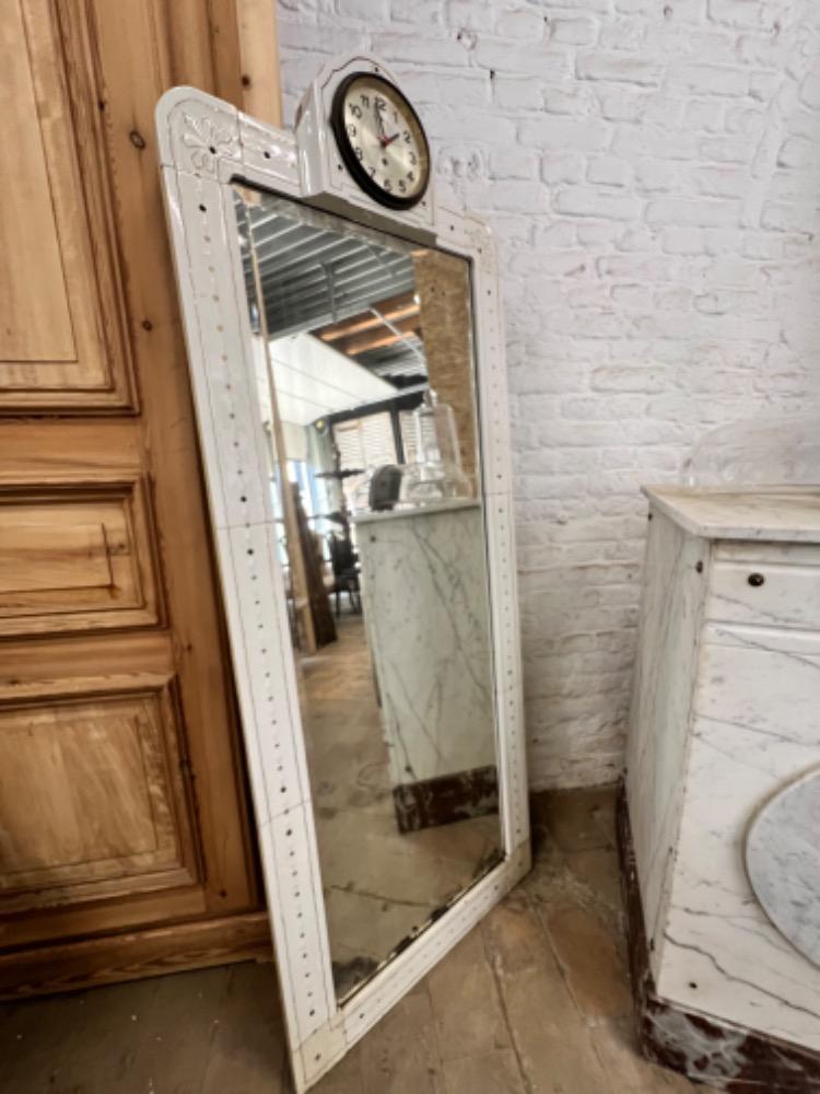 Earthenware mirror with clock, early 20th century 