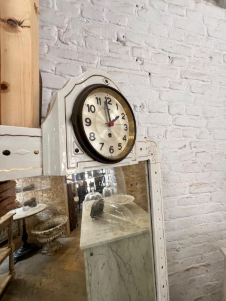 Earthenware mirror with clock, early 20th century 