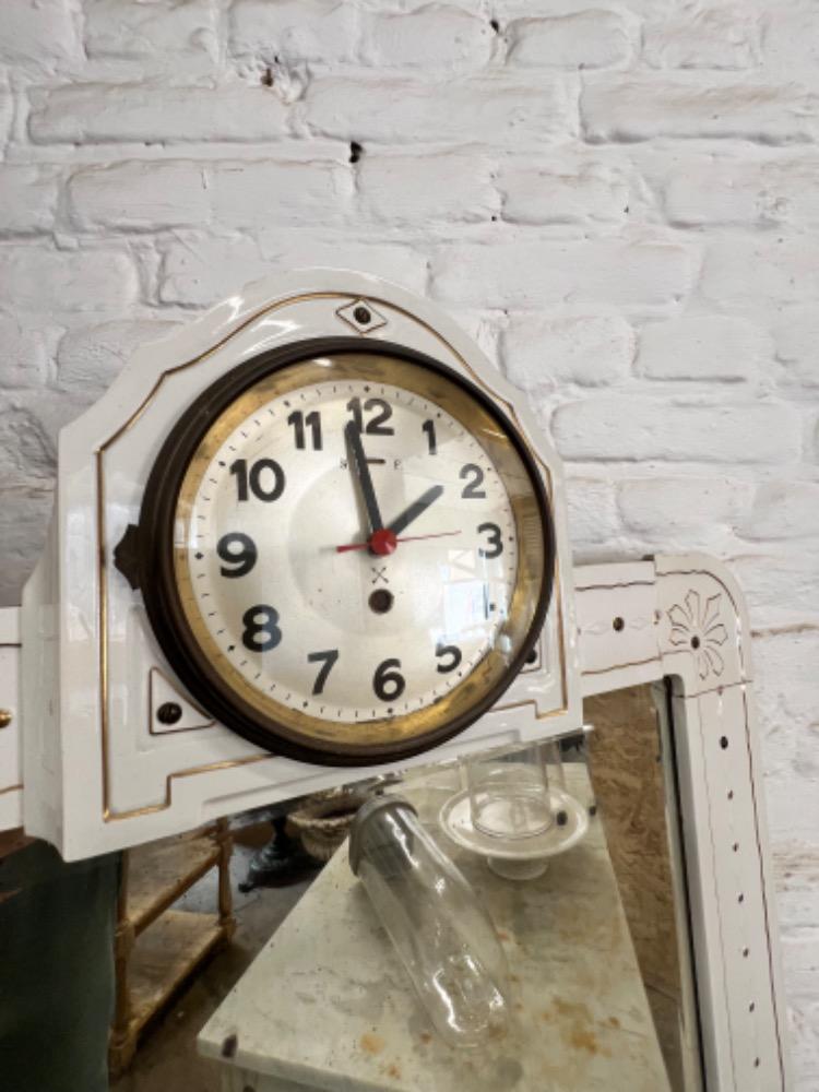 Earthenware mirror with clock, early 20th century 