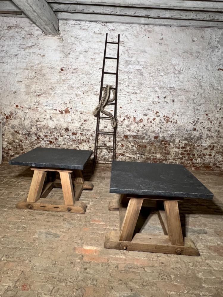 Pair of wooden and stone top tables, early 20th century 