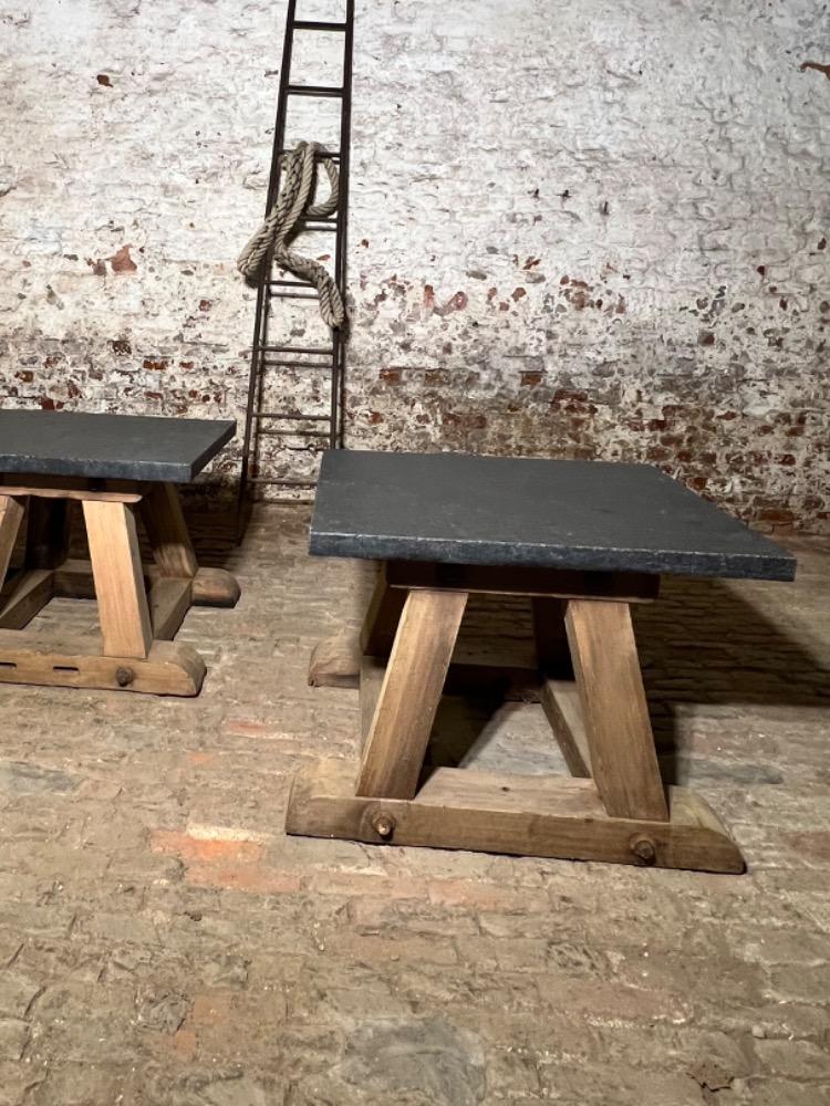 Pair of wooden and stone top tables, early 20th century 