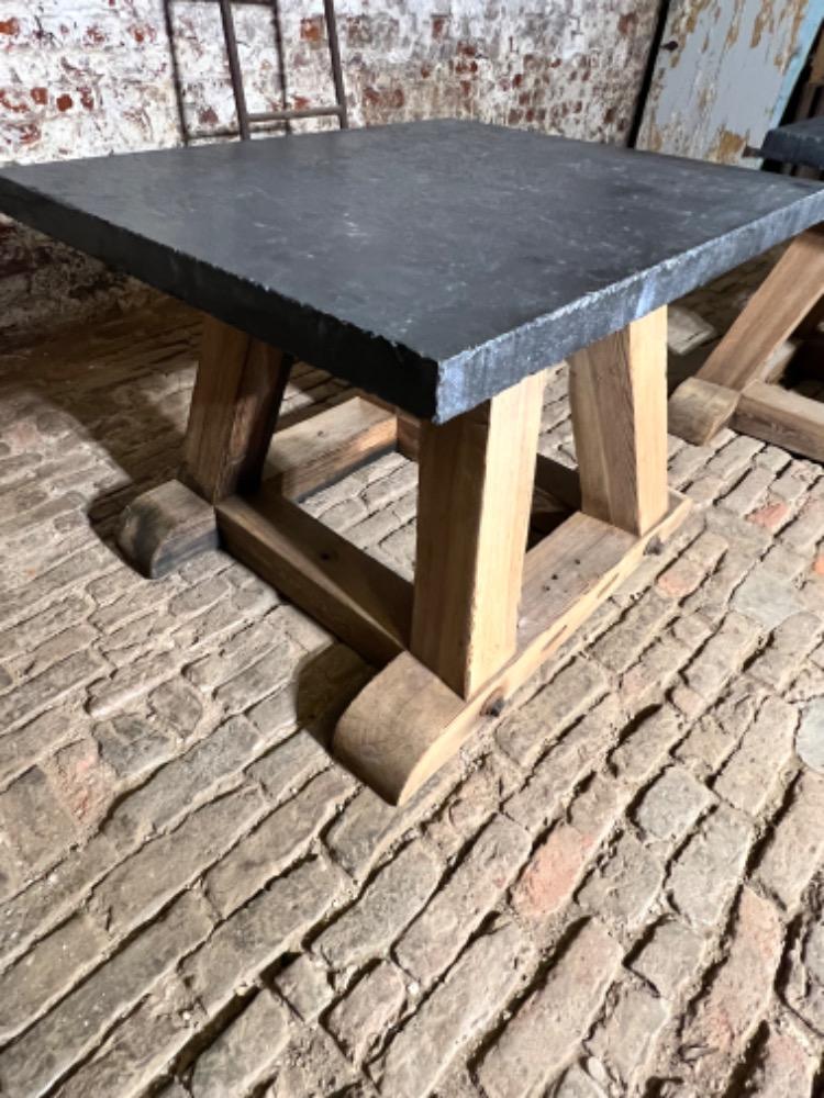 Pair of wooden and stone top tables, early 20th century 