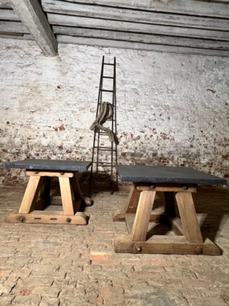 Pair of wooden and stone top tables, early 20th century 