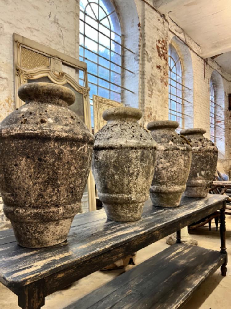 Series of four concrete vases, mid-20th century 