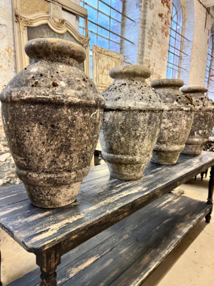 Series of four concrete vases, mid-20th century 